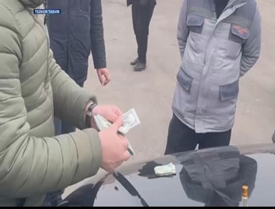 Изрображение 'В Наманганской области пресекли распространение фальшивых долларов (видео)'