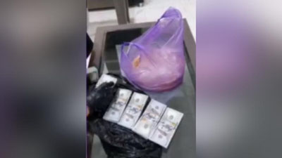 Изрображение 'Женщина пыталась вывезти в пакете с хлебом десятки тысяч долларов в Кыргызстан (видео)'