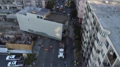 Изрображение 'В США 139-летний дом "переехал" на новый адрес прямо по улицам города (видео)'