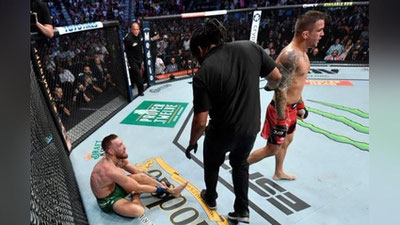 'Hisob 2-1. Dastin Pore Konor Makgregorni 3-jangda 1-raundda texnik nokaut bilan engdi'ning rasmi