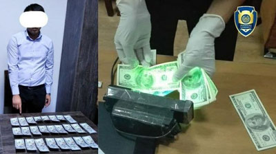 'Buxoroda fuqaroni ichki ishlar organiga ishga kiritib qo`ymoqchi bo`lgan shaxs 2 500 AQSh dollar olayotganida qo`lga olindi'ning rasmi