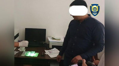 'Buxoroda transport boshqarmasi xodimi pora bilan ushlandi'ning rasmi