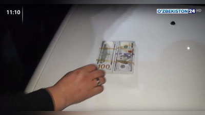 Изрображение 'В крыше салона авто нашли фальшивые $20 тысяч: случай в Сырдарье (видео)'