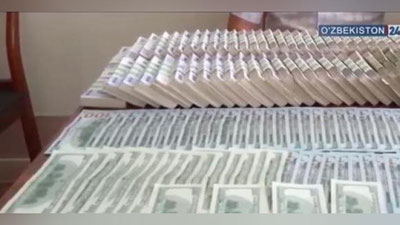 'Buxoroda noqonuniy valyuta sotgan bank xodimi qo`lga olindi (video)'ning rasmi
