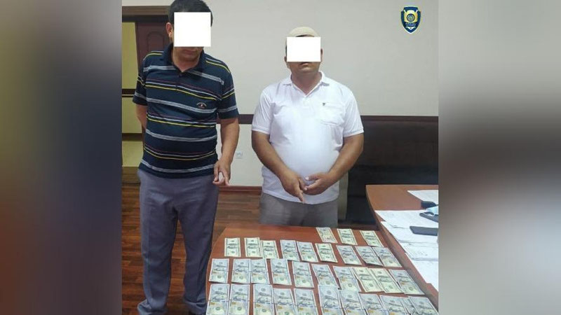 'Paxtaobod tumanida valyuta qimmatliklarini qonunga xilof ravishda o`tkazish bilan shug`ullanib kelayotgan fuqarolar ushlandi'ning rasmi