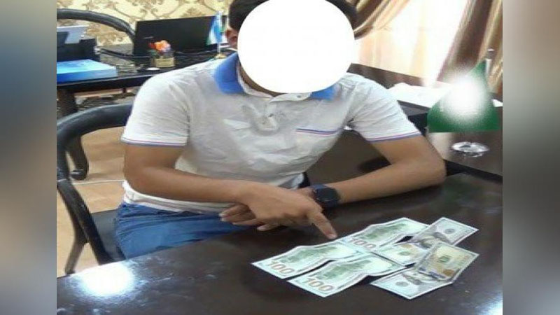 'Namanganda fuqaroni 3 ming AQSh dollari evaziga Germaniyaga ishga yubormoqchi bo`lgan shaxs ushlandi'ning rasmi