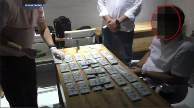 'Toshkentda DUK xodimi ko`p qavatli turar-joy binolari qurishga ruxsat rasmiylashtirib berish uchun 300 ming AQSh dollari olayotgan vaqtida qo`lga olindi (video)'ning rasmi