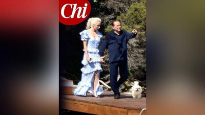 Изрображение 'Разница в полвека: Берлускони показался на публике с новой подругой'