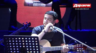 '“Tik-tok”da tanilib, internetni "portlatib", "Xalqlar do`stligi"da porlagan yulduz. Jaloliddin Ahmadalievning jonli ijrodagi ilk yakkaxon konsertidan reportaj (video)'ning rasmi