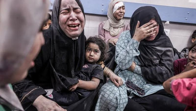 'Ғазодаги аёллар қўлларида болалари билан тезроқ ўлиш учун дуо қилмоқдалар — БМТ'ning rasmi