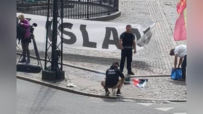 'Iroqning Daniyadagi elchixonasi oldida Qur`on yoqib yuborildi'ning rasmi