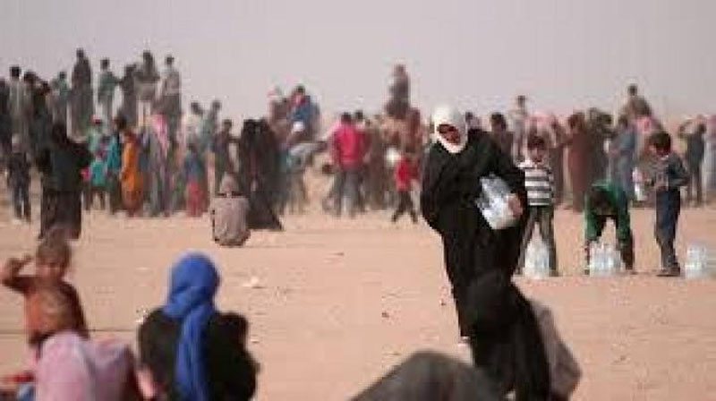 'Iroqning Mosul shahri aholisi och-nahor yashamoqda'ning rasmi