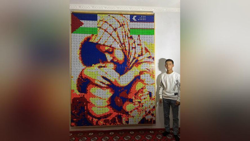 'O`zbekistonlik yigit kubikdan qo`lida farzandi bor g`amgin falastinlik ayol tasvirini yaratdi'ning rasmi