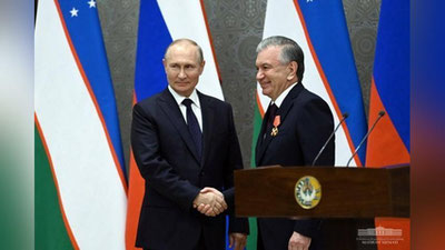 Изрображение 'Владимир Путин наградил Шавката Мирзиёева орденом Александра Невского'
