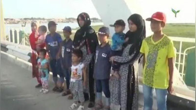 'Terrorchilik harakati a`zosi bo`lgan ayollar farzandlari bilan O`zbekistonga qaytarildi (video)'ning rasmi