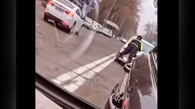 Изрображение 'В Ташкенте водитель "Нексии" прокатил инспектора ДПС на капоте (видео)'