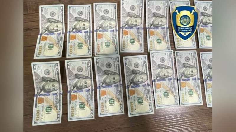 'Zangiotada yuk mashinasi haydovchilariga qalbaki 1 400$ bergan fuqaro ushlandi'ning rasmi