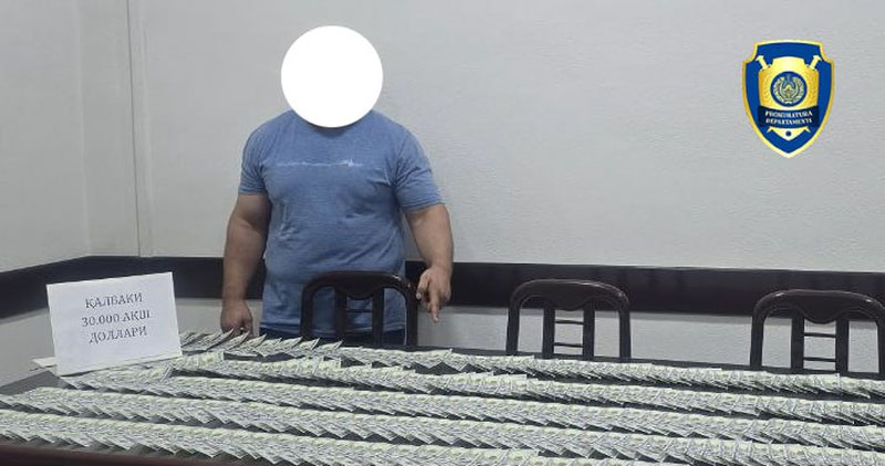 Изрображение 'В Намангане пассажира "Ласетти" задержали с 30 тысячами фальшивых долларов'