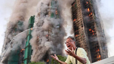 Image of 'In Hong Kong, 13 people died due to a large fire.'