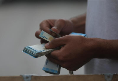 'Сурия янги миллий валютани муомалага киритмоқда'ning rasmi