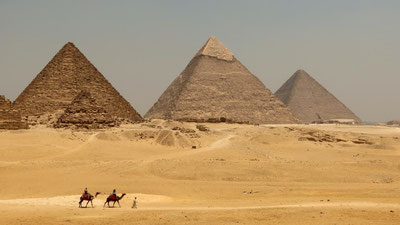 Image of 'The pyramid devouring the drawing hand was captured.'