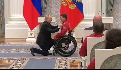 Image of 'Putin presented the Paralympic champion Golubkov with a car.'
